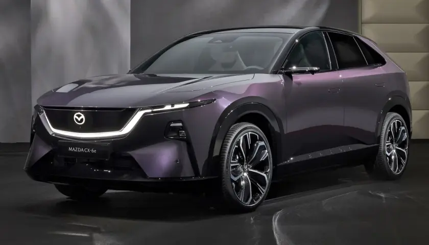 Elegancka, fioletowa mazda elektryczna CX-6e z nowoczesnym oświetleniem LED i designerskimi felgami.